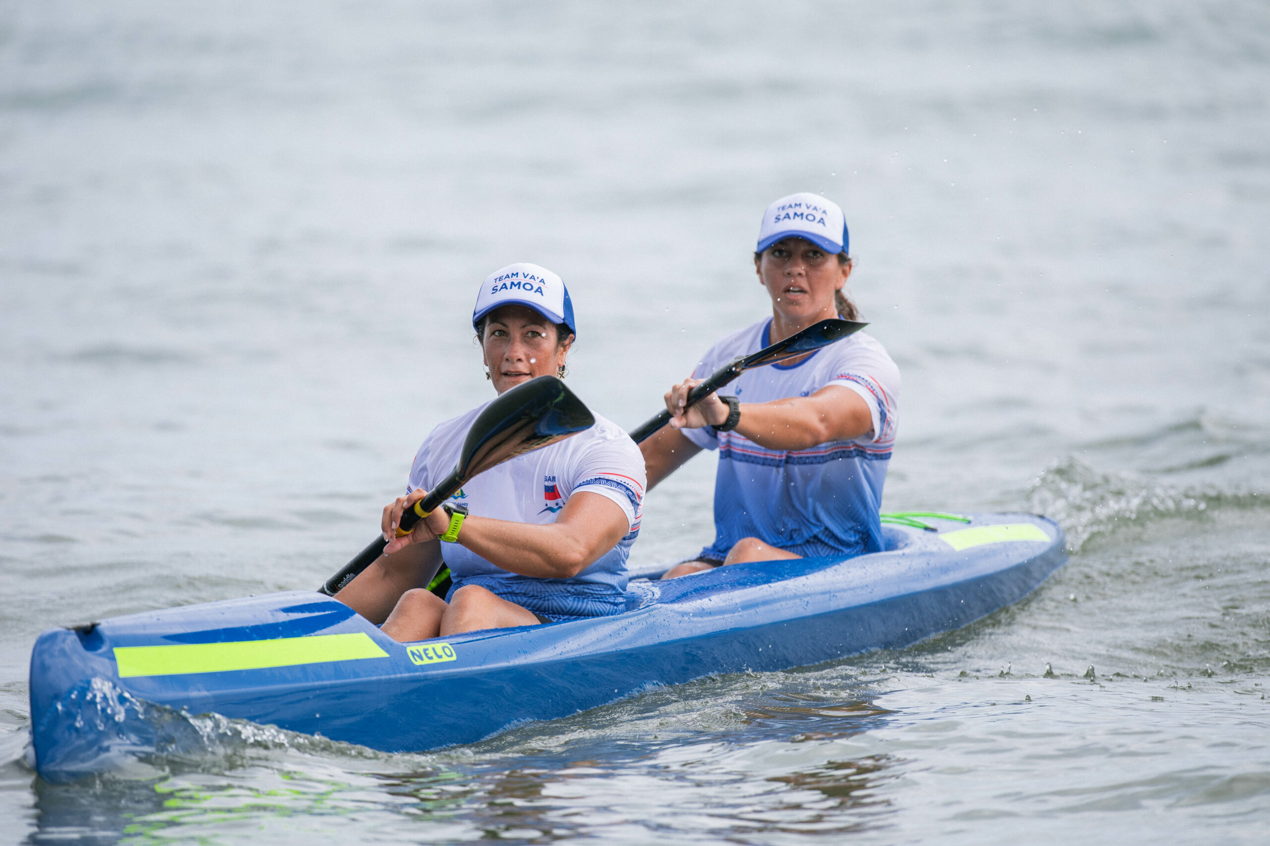 Two women in a kayak race
