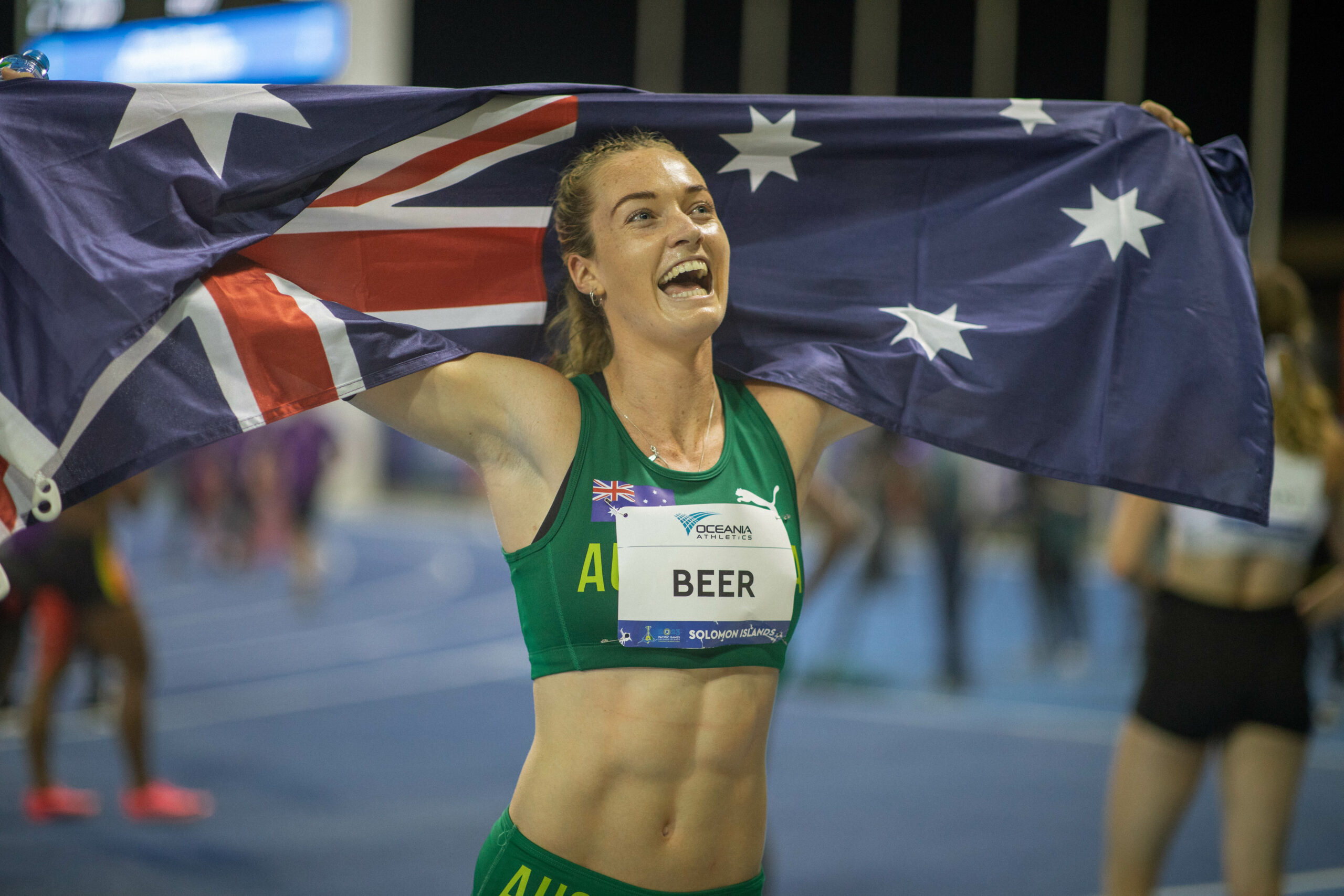 An Australian runner winning a race