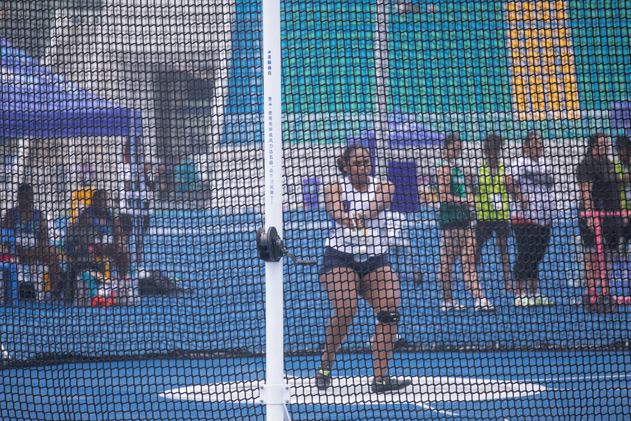 A woman throwing a hammer in athletics