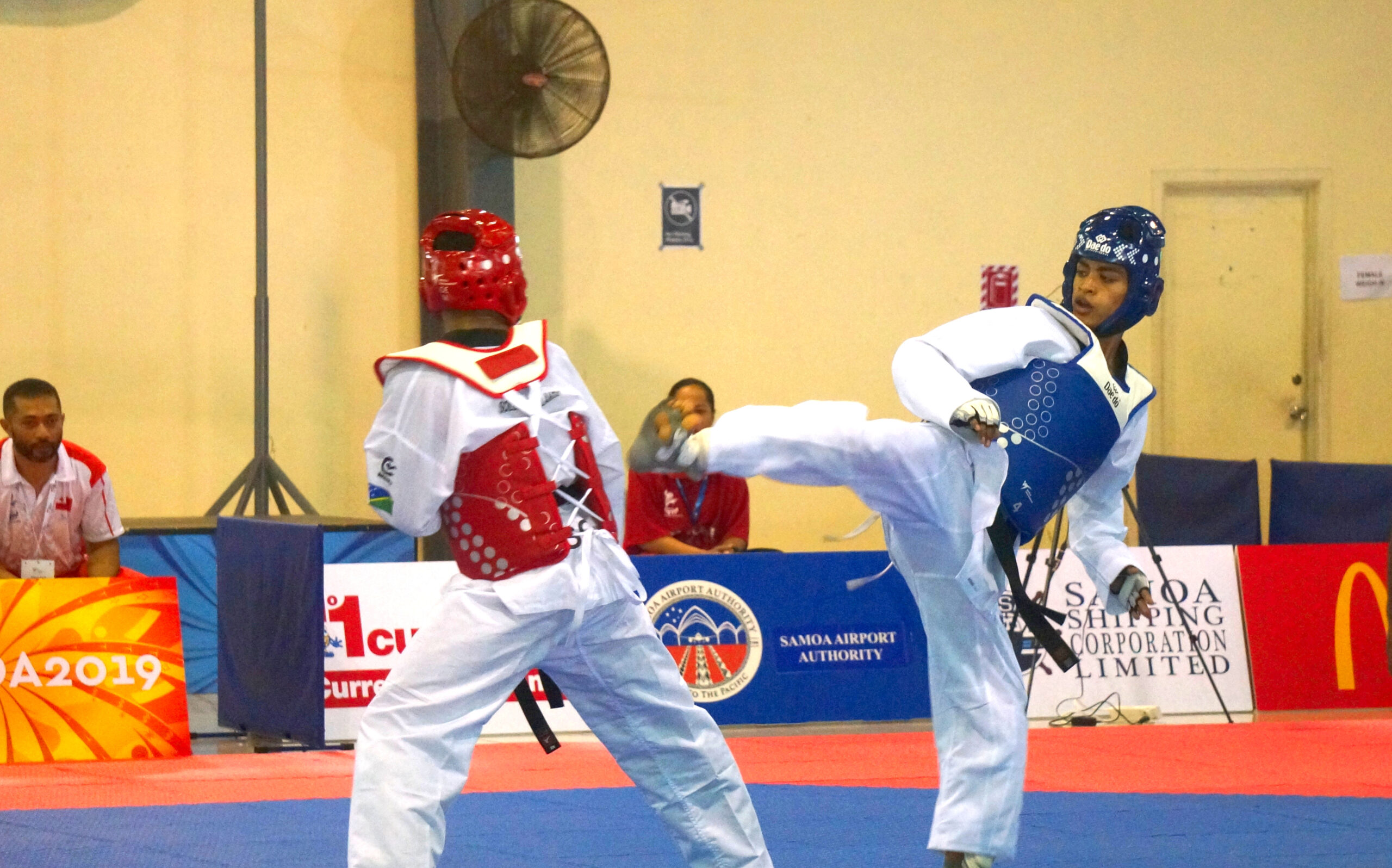 Women competing in taekwondo