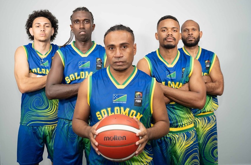 Five male basketball players