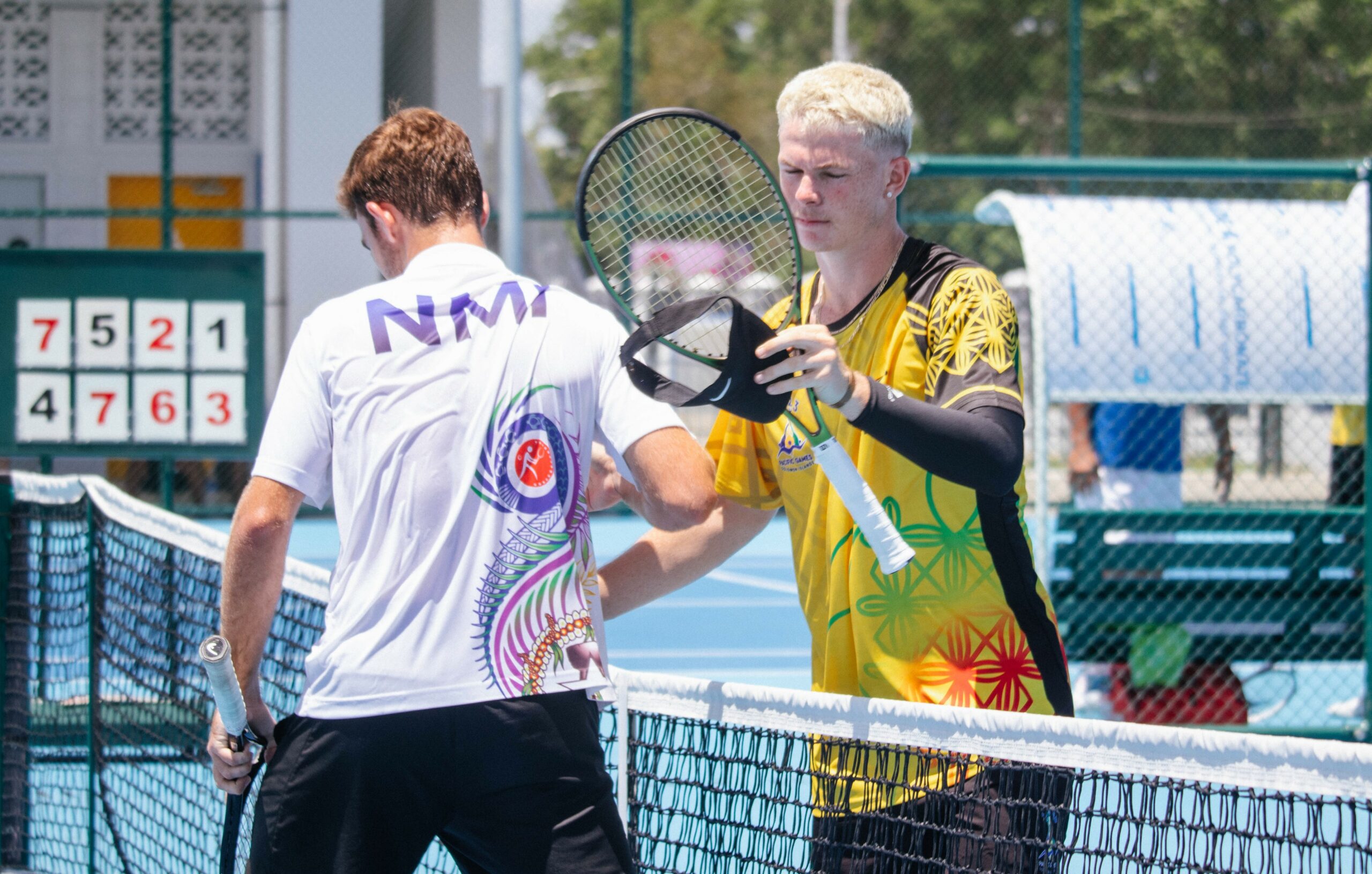 Two male tennis players shaking hands