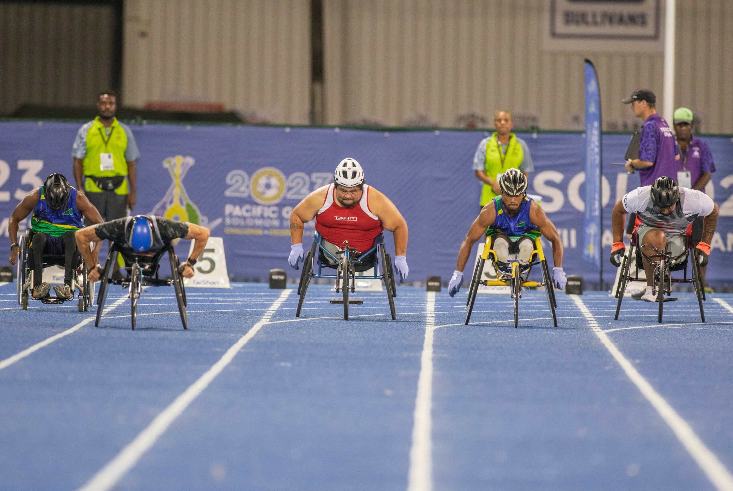 Men racing in wheelchairs
