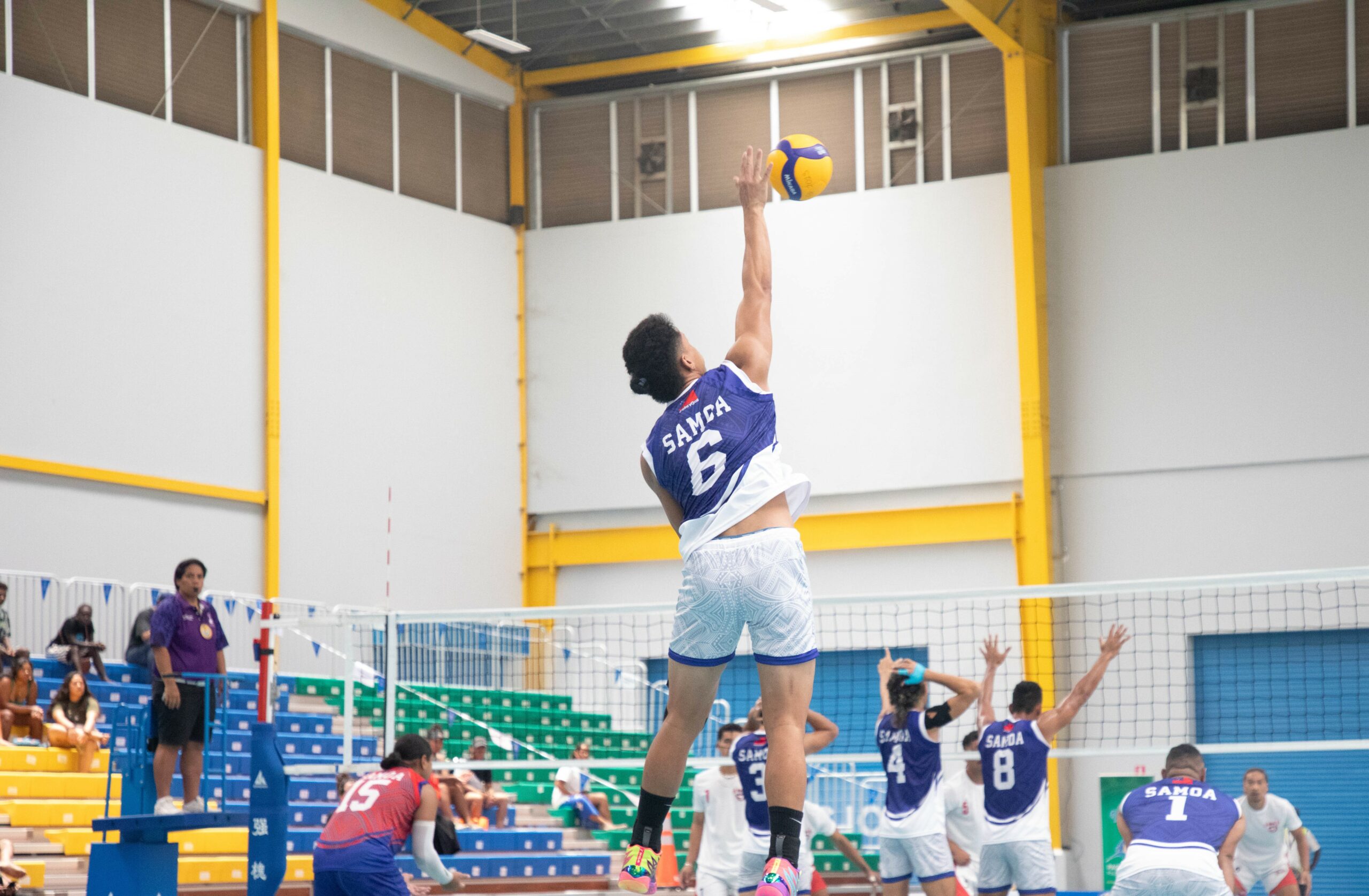 A man playing volleyball