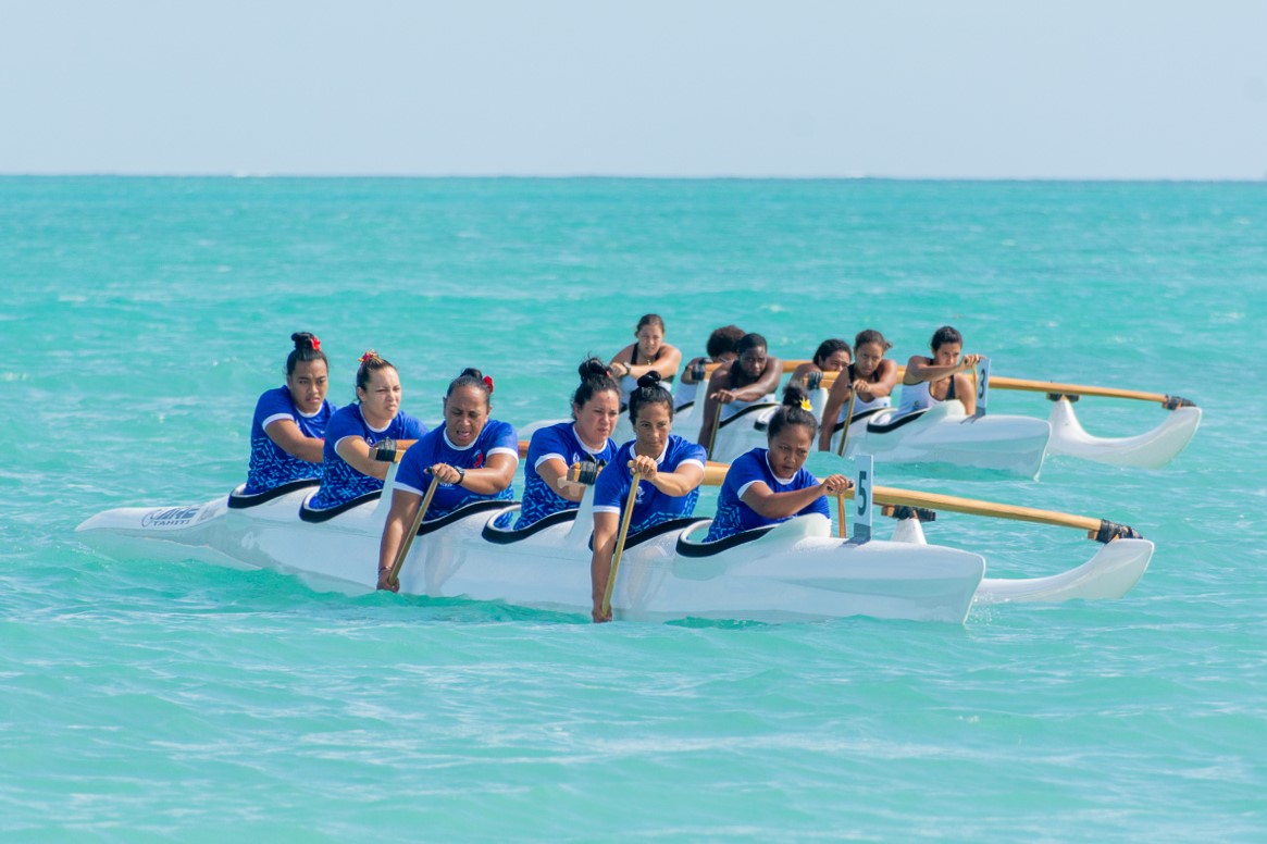 Women paddling outrigger canoes