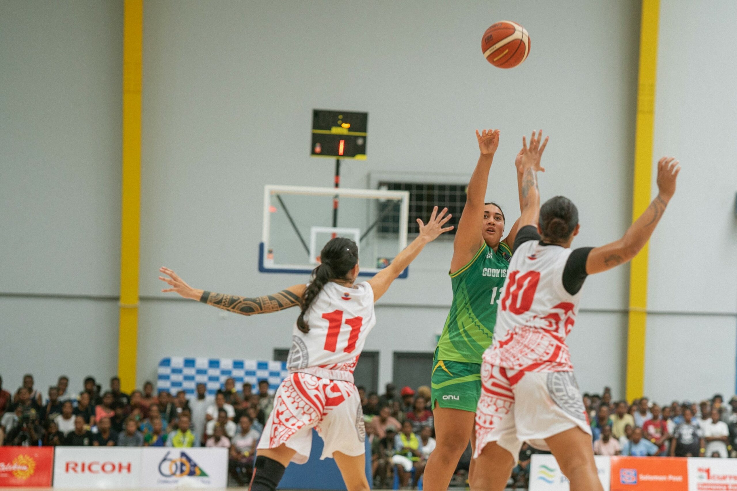 Women playing basketball