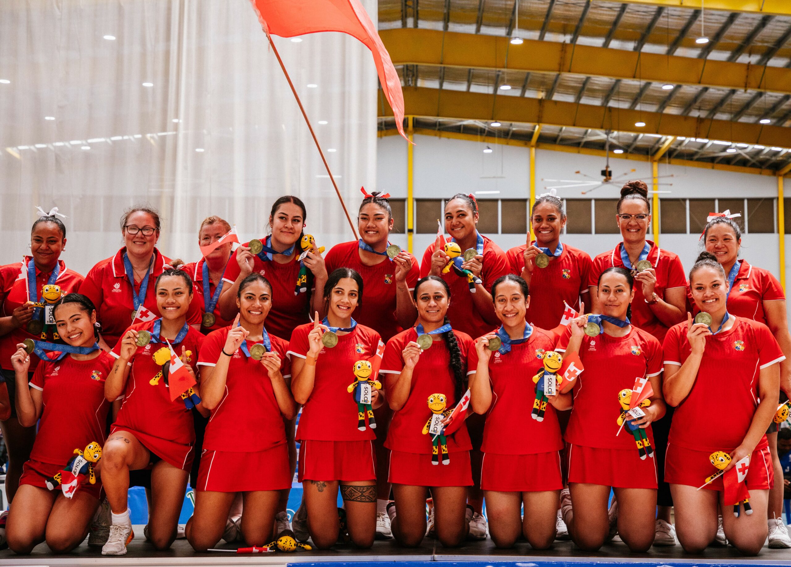 A netball team with gold medals